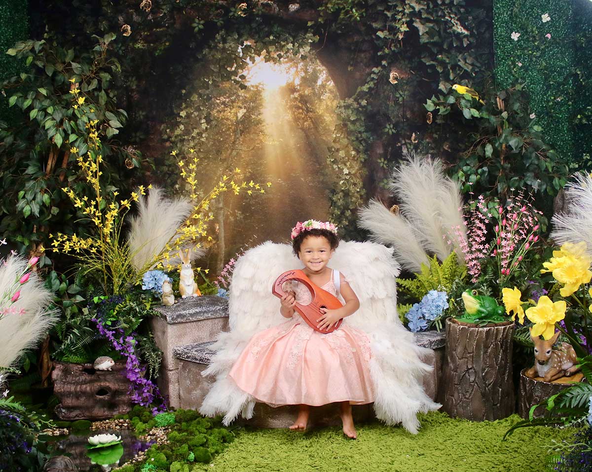 Professional family photography session at KrissyK Studios indoor garden setting with children - Charlotte NC and Greenville SC