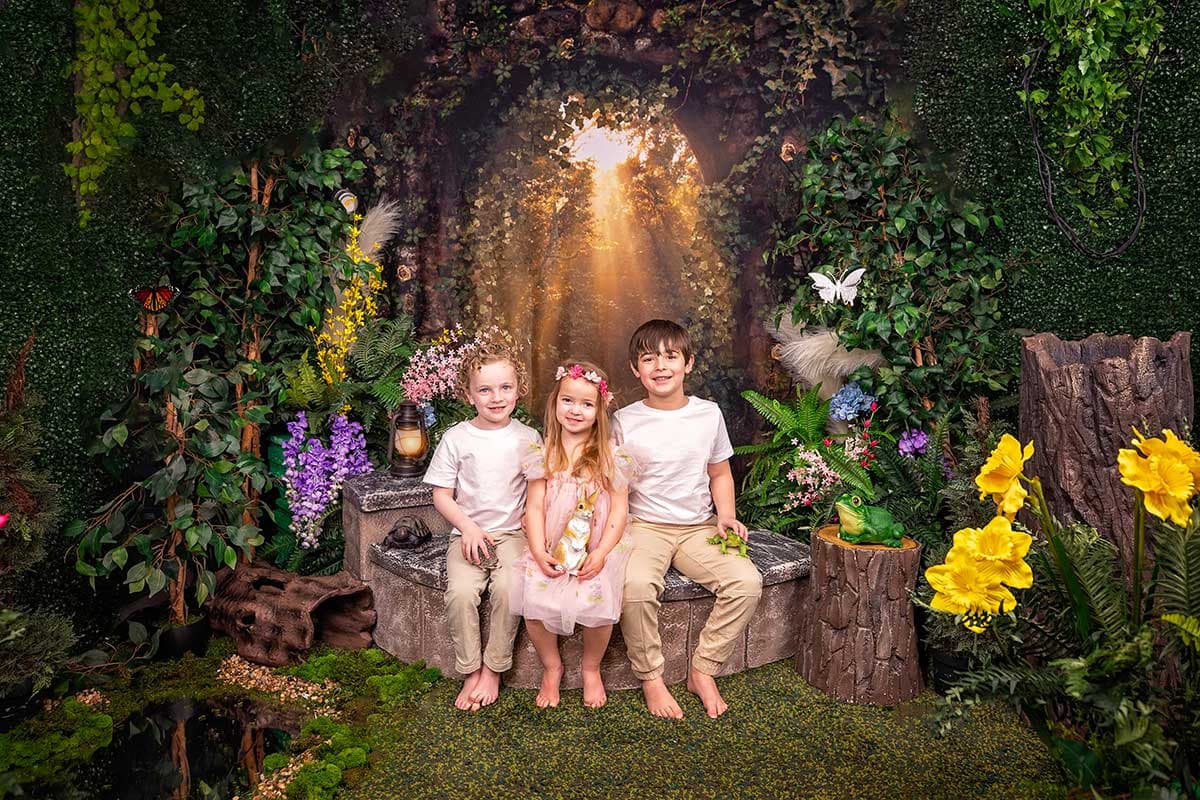 Professional family photography session at KrissyK Studios indoor garden setting with children - Charlotte NC and Greenville SC